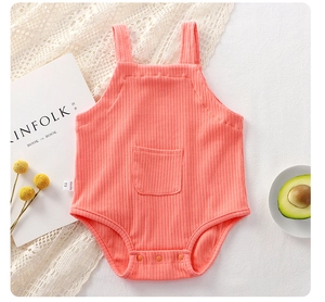 Detail of baby ribbed cotton bodysuit with front pocket and snap buttons at the crotch