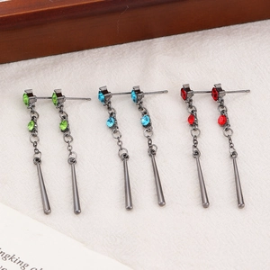 Detail view of water drop geometric earrings with green, blue and red stones
