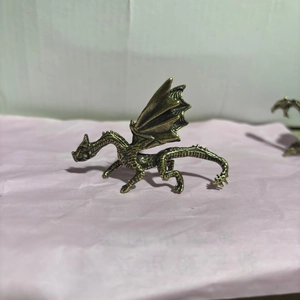 Vintage bronze alloy fire dragon ornament with detailed scales and wings for desk decor