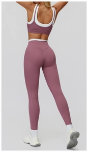 Detail view of the back fit for ribbed yoga set with burgundy sports bra and leggings