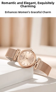 Close-up of rose gold mesh strap watch with sparkling crystal index on a sleek display