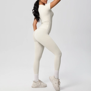 Detail view of skin-friendly cream yoga set with tight short sleeves and high waist pants