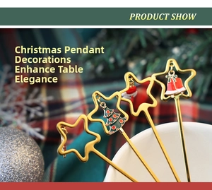Detail of gold stainless steel spoons featuring festive enamel Christmas charms