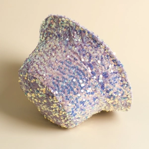 Detail shot of purple sequin bucket hat showing holographic shimmer and fold texture