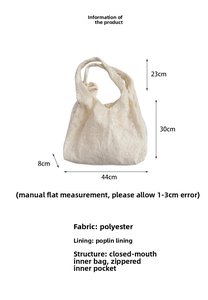 Close-up of beige lace embroidered tote bag with internal zipper pocket details