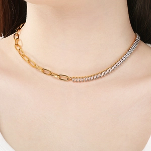 Detailed view of golden paperclip chain necklace with sparkling zircon tennis link style