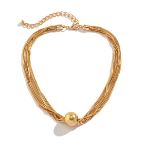 Detail shot of multi-layer gold chain necklace featuring a polished large sphere pendant