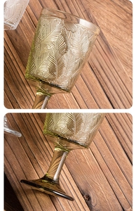Detail of vintage embossed leaf pattern on high-quality light green glass wine goblet
