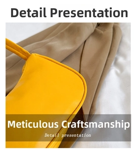 Detailed close-up of smooth yellow PU leather underarm bag with precision side stitching