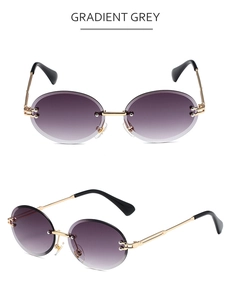 Detail view of rimless gradient grey sunglasses with elegant golden metal temples