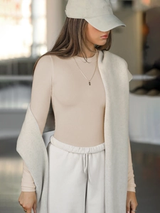 Close-up of ribbed long-sleeve Y2K slim-fit top with textured fabric details