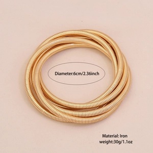 Detail view of gold multi-layer snake bone bracelet with size and material labels