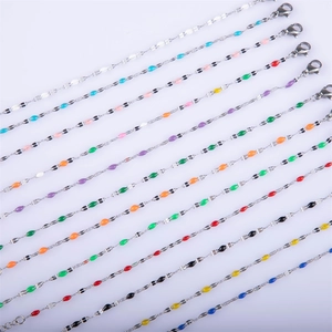 Detail of colorful enamel charms on stainless steel chains with lobster clasps
