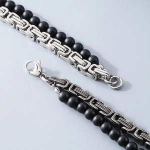Detail of silver byzantine chain and matte black onyx beads for men's bracelet