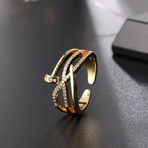Macro shot of gold-plated triple layer nail ring featuring micro-pave white zircons