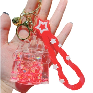 Luminous red quicksand castle keychain with acrylic pendant and star strap charm