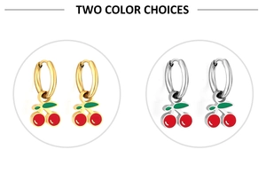Detailed view of cherry pendant earrings in gold and silver finish on white background