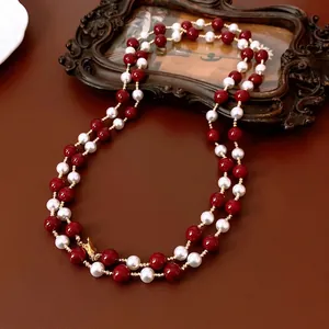 Vintage double-layer long necklace with white pearls, red beads and golden metal spacers