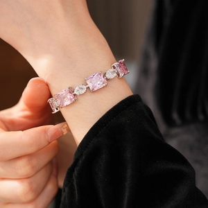 Macro detail of luxury pink rectangular gemstone bracelet with sparkling zircon stones