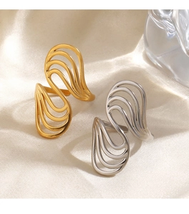 Detailed macro view of wavy 18K gold and silver plated stainless steel open rings