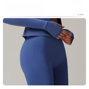 Detail of navy seamless knit yoga leggings with curved jacquard to lift and shape buttocks
