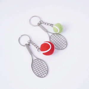 Miniature tennis racket and ball keychain set in red and neon green for sports fans