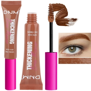 Detailed view of DNM brown brow mascara with fiber texture brush and makeup application