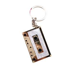 Golden cassette tape keychain with I Love Friend text on white background