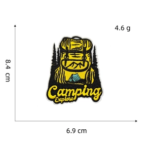 Close-up of yellow camping backpack embroidery patch showing details and dimensions