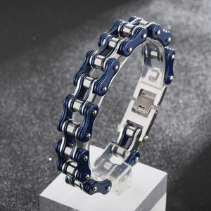 Detail of blue and silver bicycle chain bracelet in titanium steel with metallic texture