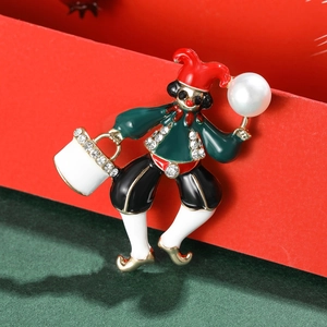 Christmas clown brooch with colorful enamel rhinestones and pearl on festive background