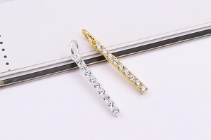 Close-up of rectangular bar pendants with micro-set cubic zirconia in gold and silver