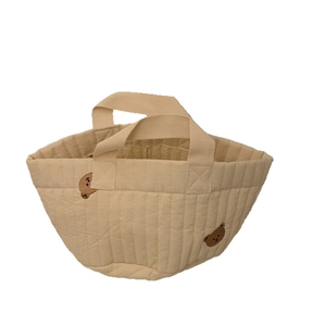 Quilted beige storage bucket bag with embroidered bears and top handles for snacks