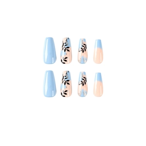Blue and pink gradient press-on nails with black leaf motifs and silver glitter accents
