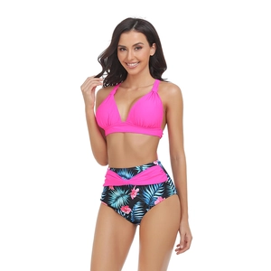 Two-piece halter bikini with rose pink top and high-waisted tropical floral print bottom