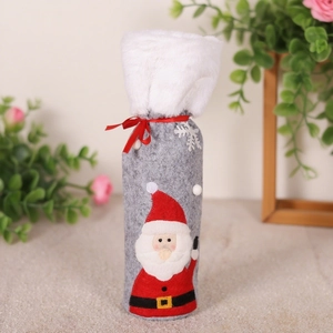 Christmas wine bottle cover in gray felt with white plush trim and festive red ribbon