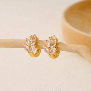 Golden hoop earrings with marquise-cut white zircon in wheat leaf design on a branch