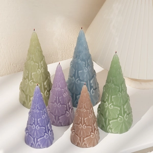 Set of six colorful embossed Christmas tree candles with vintage leaf textures