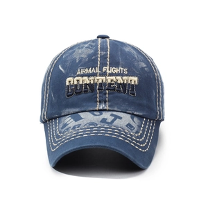 Vintage washed blue denim baseball cap with 3D embroidery and distressed brim details