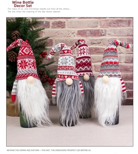 Set of 4 knitted Christmas gnome wine bottle covers with snowflakes and faux fur beards