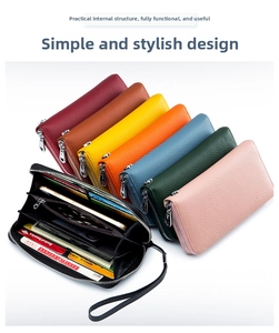 Detail view of multi-color leather wallets with zip-around closure and wrist strap