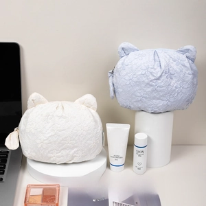 Cute cat-ear makeup bags with floral embroidery in white and light blue colors