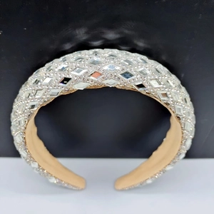 Detail of baroque padded headband featuring reflective silver geometric crystal embellishments