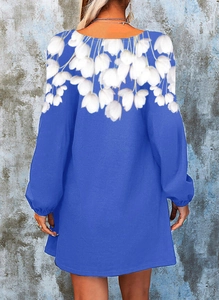 Back view of a blue long-sleeve dress featuring white tulip floral prints on the shoulders