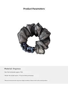 Detailed view of 10cm organza scrunchie with beaded flower and elegant mesh texture
