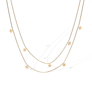 Close-up of double-layered 18K gold plated stainless steel necklace with star pendants