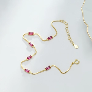 Detailed close-up of S925 sterling silver box chain bracelet with red square gemstones