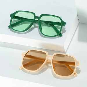 Stylish square macaron color sunglasses with oversized frames in green and beige finish