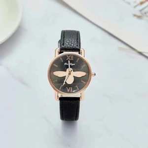 Luxury ladies quartz watch featuring a gold bee motif, black leather strap, and rose gold case