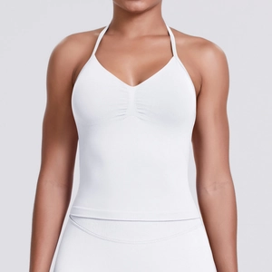 Detailed front view of white halter neck sports bra with ruched chest and knit texture